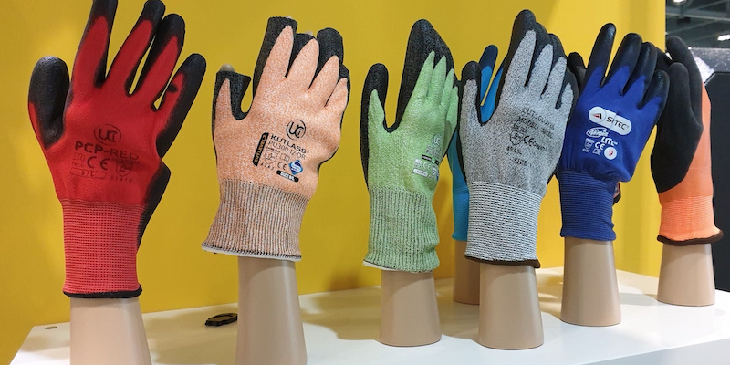 Protective work gloves displayed in various colours with different safety features